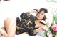 A woman laying on a bed next to a bouquet of flowers.